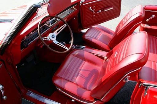 Restored bucket seats in a classic car with new seat foam